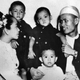 Aung San Suu Kyi, age two, is seen with her parents and two elder brothers in 1947.